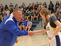  coach and player shake hands before a game